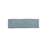 Glossy sky blue ceramic wall tile with handcrafted Spanish artisan character