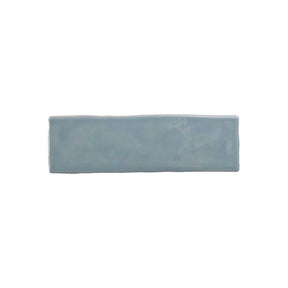 Glossy sky blue ceramic wall tile with handcrafted Spanish artisan character