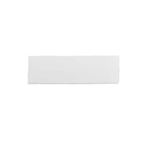 Glossy soft white ceramic wall tile with handcrafted Spanish artisan detailing