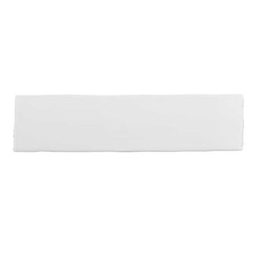 Glossy soft white ceramic subway tile with handcrafted Spanish artisan detailing