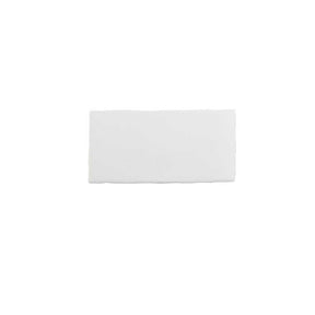 Glossy soft white ceramic subway tile with handcrafted Spanish artisan texture