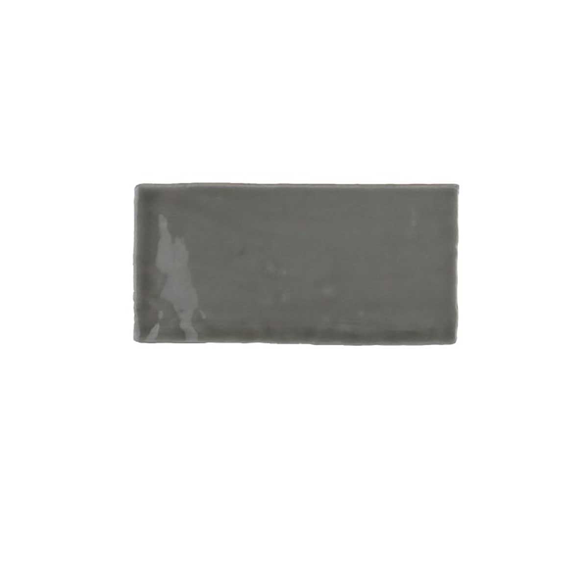 Glossy yellow ceramic subway tile with handcrafted Spanish artisan texture