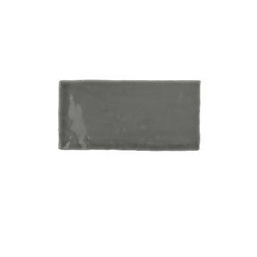 Glossy yellow ceramic subway tile with handcrafted Spanish artisan texture