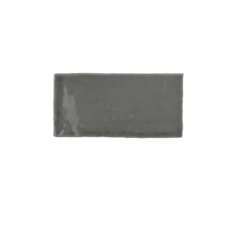 Glossy yellow ceramic subway tile with handcrafted Spanish artisan texture