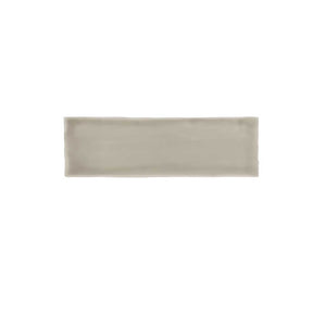 Glossy taupe ceramic wall tile with handcrafted Spanish artisan character