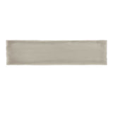Glossy taupe ceramic subway tile with handcrafted Spanish artisan detailing