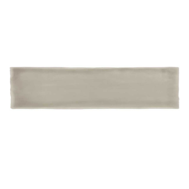 Glossy taupe ceramic subway tile with handcrafted Spanish artisan detailing
