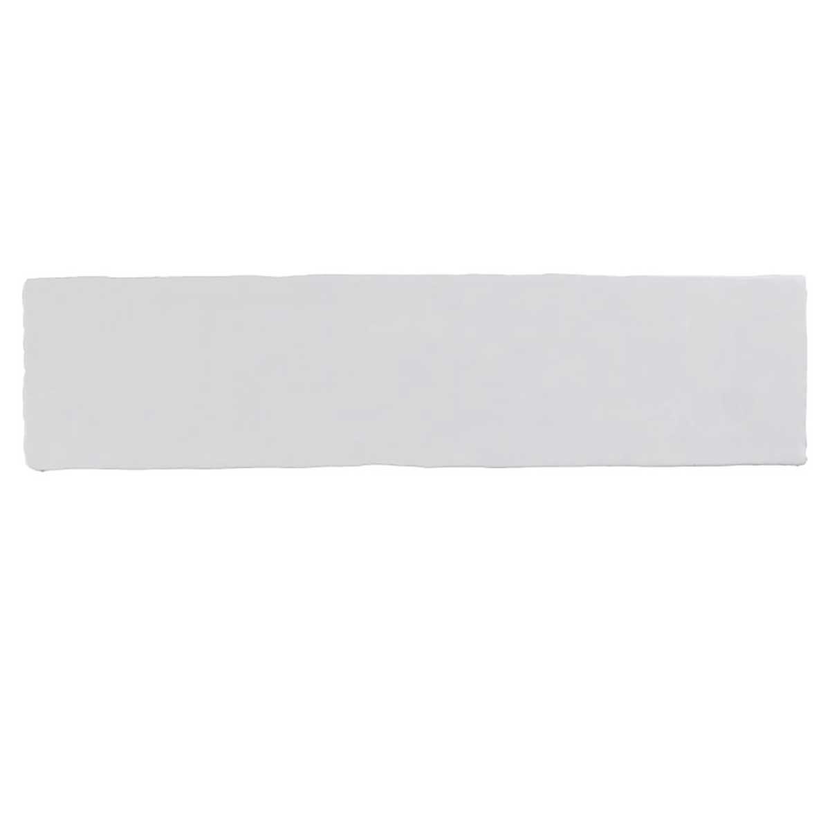Glossy white ceramic subway tile with handcrafted Spanish artisan detailing