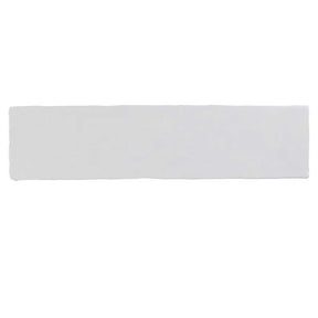 Glossy white ceramic subway tile with handcrafted Spanish artisan detailing