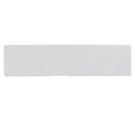 Glossy white ceramic subway tile with handcrafted Spanish artisan detailing
