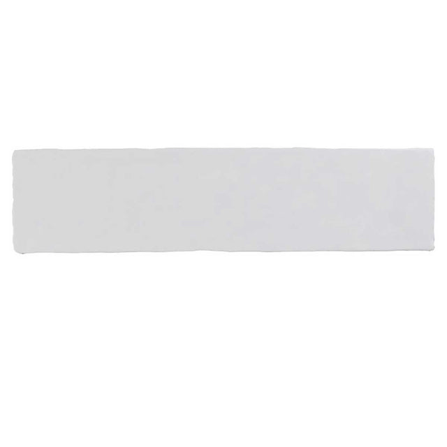 Glossy white ceramic subway tile with handcrafted Spanish artisan detailing