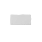 Glossy white ceramic subway tile featuring handcrafted Spanish artisan texture