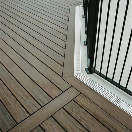 Wooden deck with a glass door threshold and Lauxes Grates Custom Linear shower Drain NeXT Generation - Silk Silver