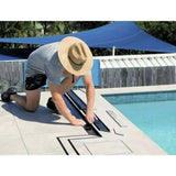 Person installing a pool cover on a pool with Close-up of a tiled floor and Lauxes Grates Custom shower drain Tile Insert in Midnight 