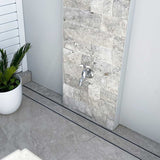 Close-up of a tiled floor with Lauxes Grates Custom shower drain Tile Insert in Silk Silver finish 