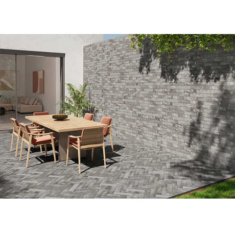 Exterior patio installation using South Loop Iron porcelain tile