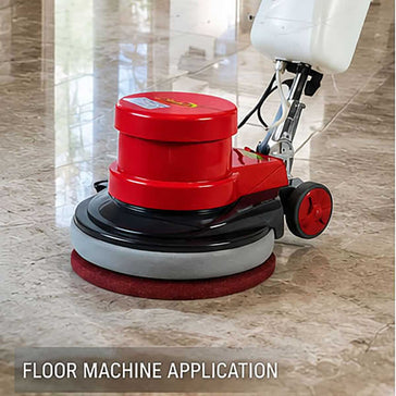 Professional floor machine restoring a natural stone floor using Modern Stone MST diamond polishing pads.