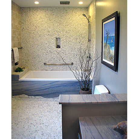 Cream pebble mosaic shower floor creating a bright spa inspired retreat