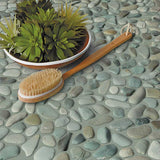 Sea Green pebble mosaic shower floor creating a relaxing spa inspired retreat