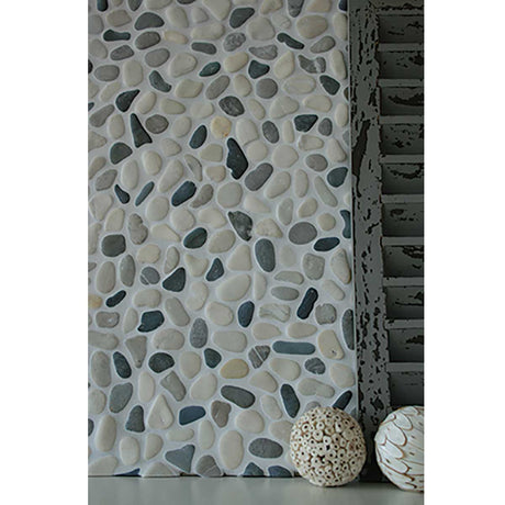 Shadow pebble mosaic shower floor creating a luxury spa inspired retreat