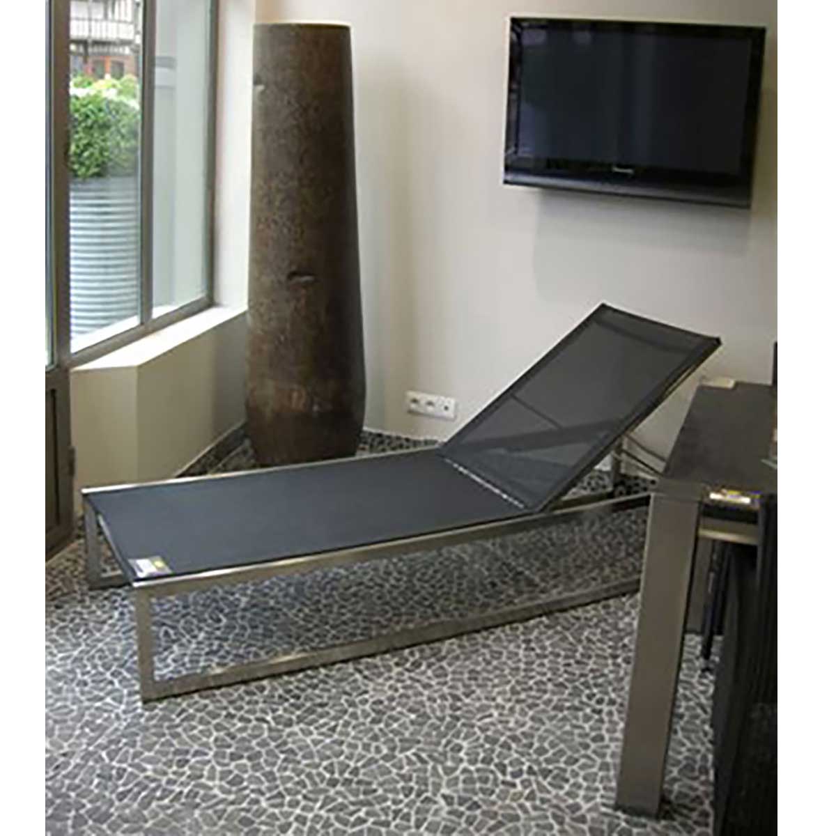 Luxury walk in shower featuring Lava Black pebble mosaic flooring
