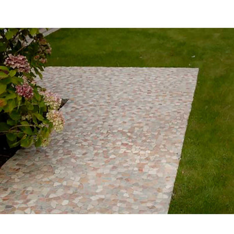 Natural pebble mosaic shower floor featuring mixed river rock and onyx