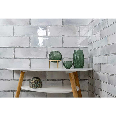 Elongated ceramic wall tile with aged parchment appearance