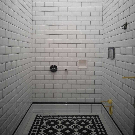  Porcelain recessed soap dish installed in white subway tiled shower wall