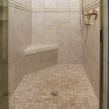 Custom tiled shower bench installation in residential bathroom remodel