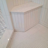 Waterproof shower seat integrated into tiled shower wall for comfortable seating