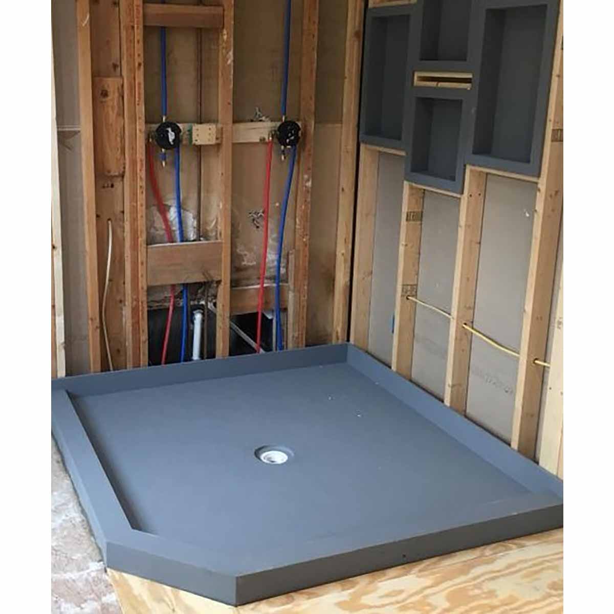 PreFormed Ready to Tile Shower Pan showing in a rough shower framed with Niches install in between the 2 x 4 studs 