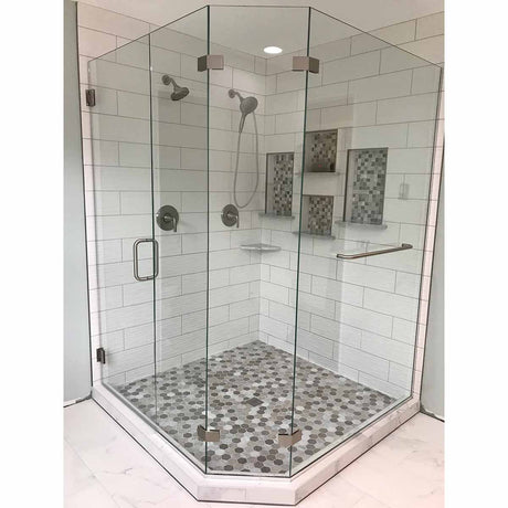 Glass shower enclosure with tiled walls and floor in a bathroom setting where the PreFormed Ready to Tile Shower Pan got installed