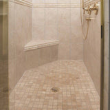 PreFormed Ready to Tile Shower Pan got installed showing in a Beige tiled shower with gold fixtures