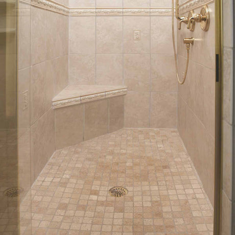 PreFormed Ready to Tile Shower Pan got installed showing in a Beige tiled shower with gold fixtures