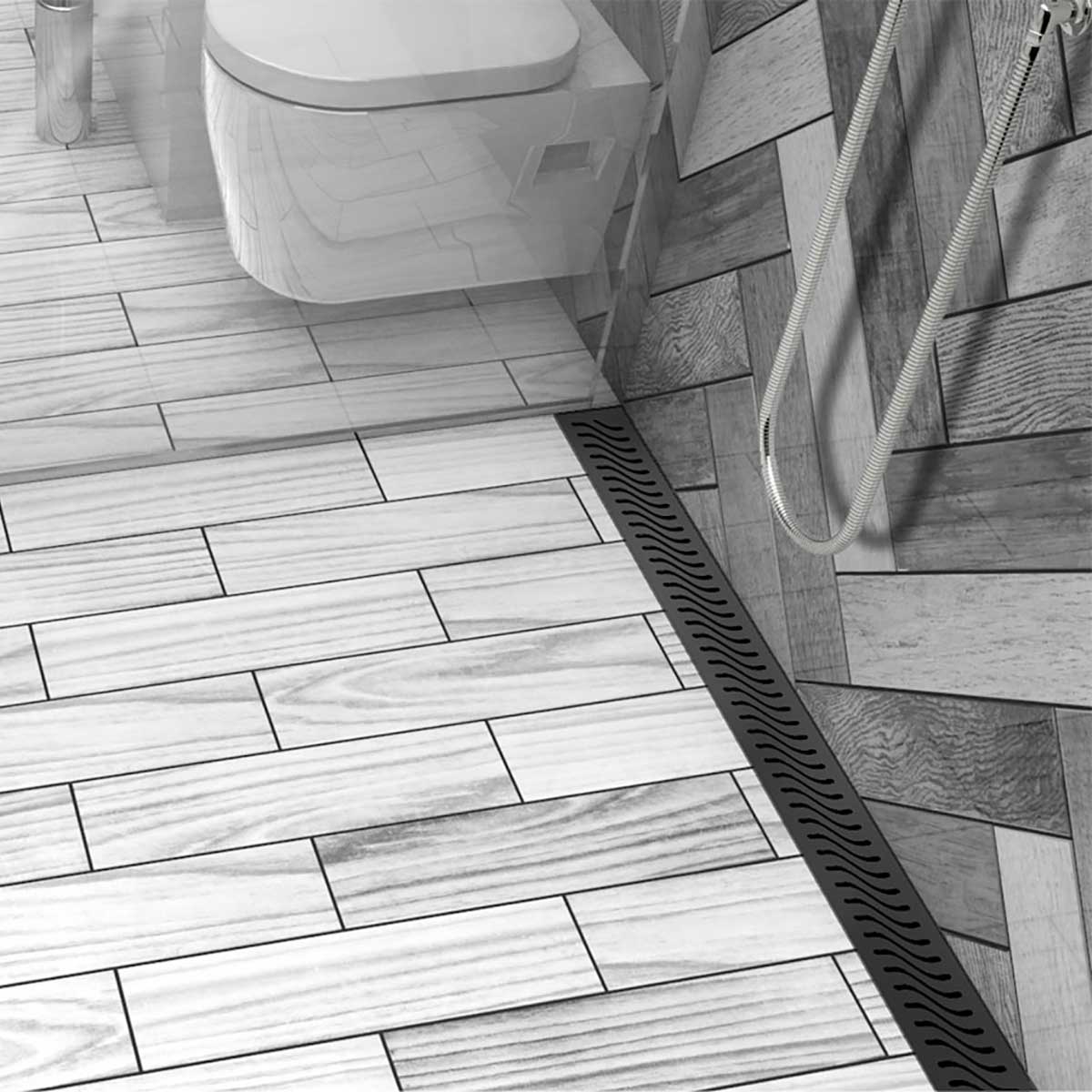 ACO Quartz stainless steel linear shower drain with Flag curved slot grate
