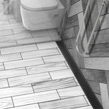 ACO Quartz stainless steel linear shower drain with Flag curved slot grate