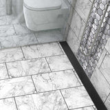 ADA accessible Matte Black linear shower drain with anti-slip wedge grate