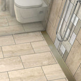 Satin Brass linear shower drain with foot-friendly wedge grate