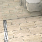 Quartz by ACO Brushed Stainless linear shower drain installed in contemporary curbless shower