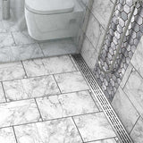 Quartz by ACO Polished Chrome linear shower drain installed in contemporary curbless shower