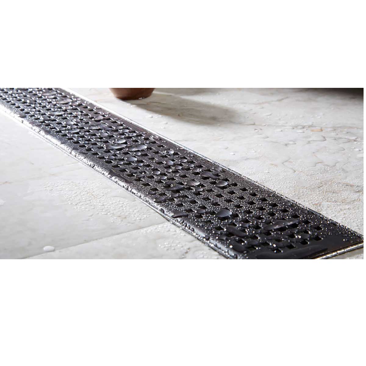 Linear shower drain with Quadrato grate brushed stainless