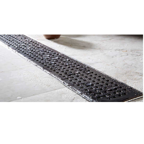 Linear shower drain with Quadrato grate brushed stainless