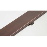 Quartz Solid linear shower drain installed in modern curbless shower with bronze bathroom fixtures