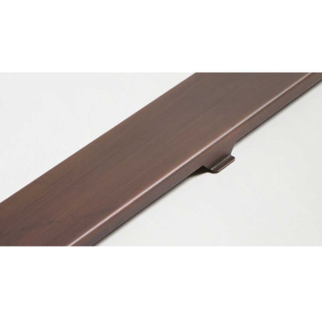 Quartz Solid linear shower drain installed in modern curbless shower with bronze bathroom fixtures
