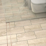 Stainless steel linear shower drain with tile insert grate and Rose Gold trim