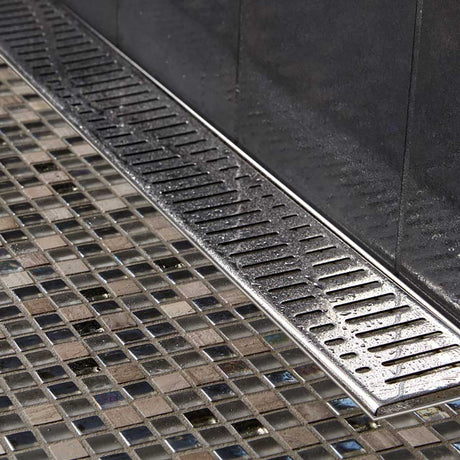 Stainless steel Quartz Wave shower drain featuring a mirror-like Polished Chrome finish