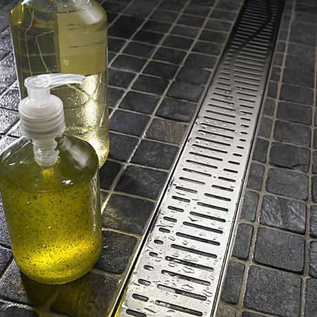 Premium Quartz Wave linear shower drain featuring an elegant Brushed Stainless finish