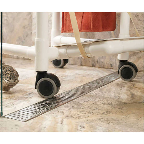 Stainless steel Wave linear shower drain installed in a luxury curbless shower