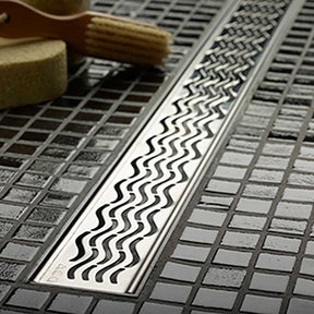 Quartz Plus linear shower drain with Waves stainless steel grate