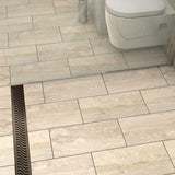 QuARTz Linear Shower Drain with Flag Grate - Oil Rubbed Bronze Installed in shower floor and toilet next to it